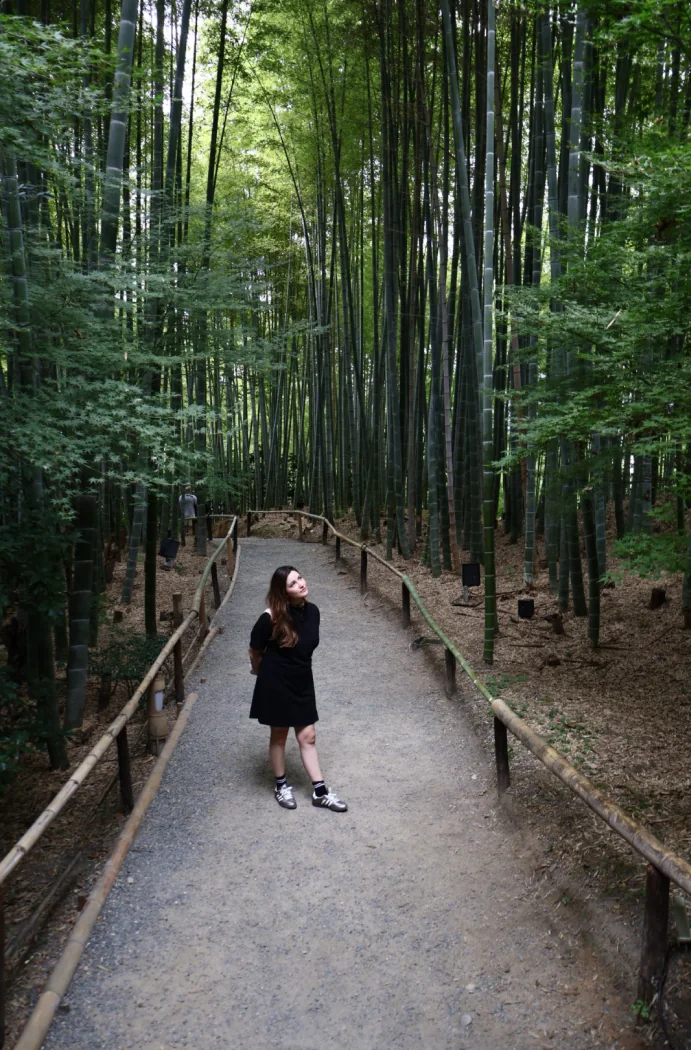 Julie García walking through a bamboo forest